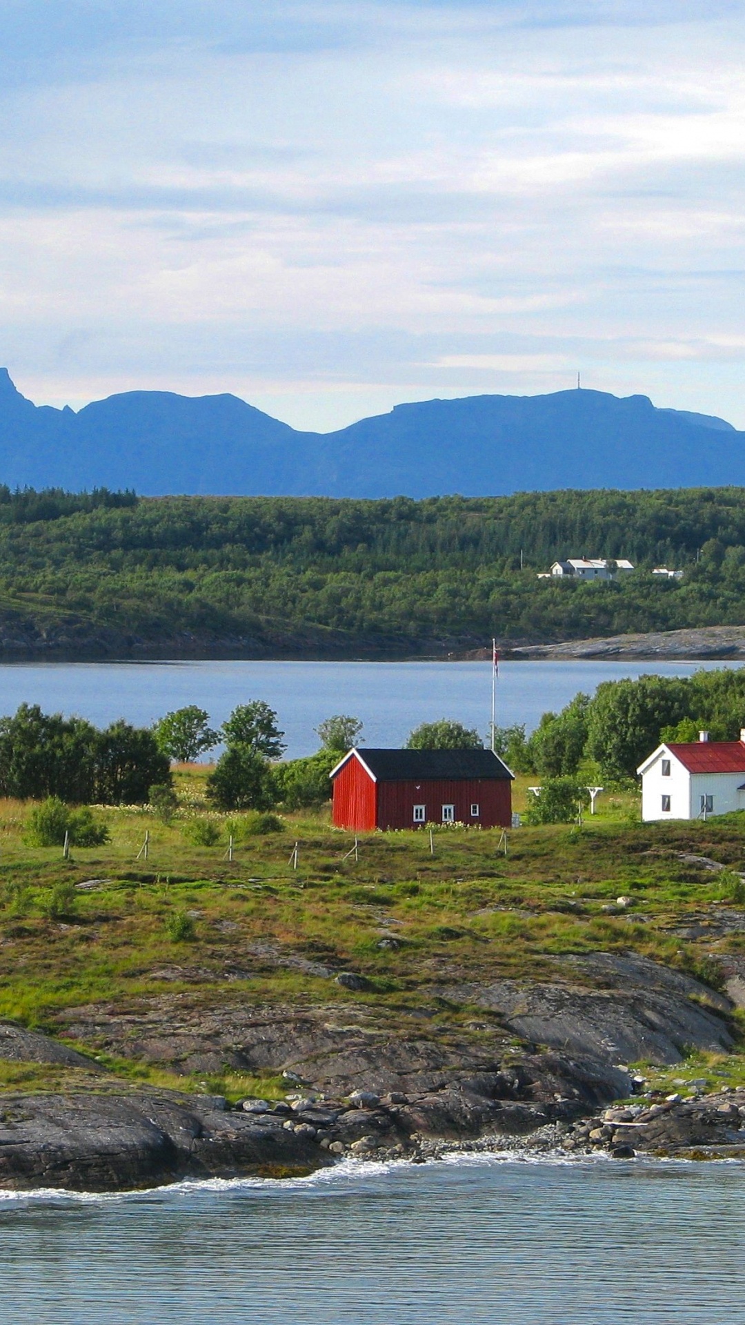 White and Red House Near Body of Water During Daytime. Wallpaper in 1080x1920 Resolution
