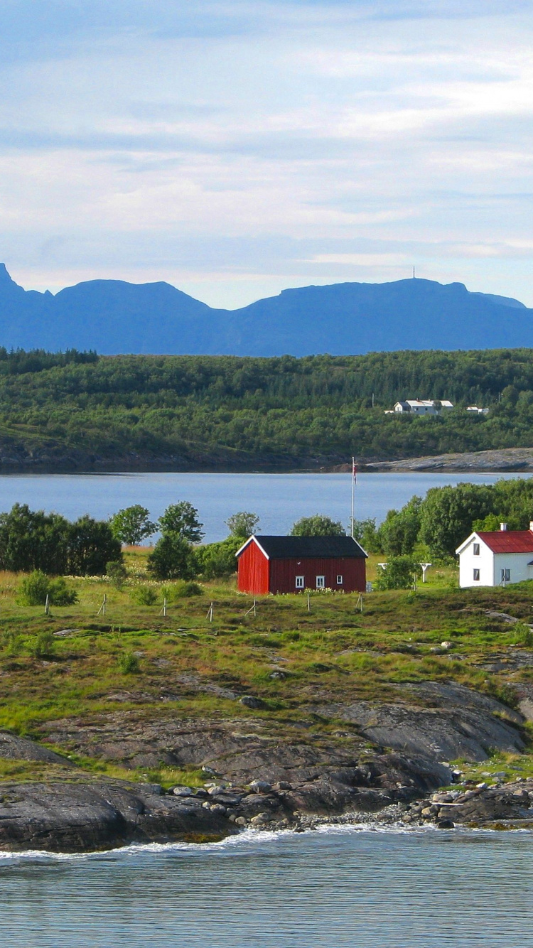 White and Red House Near Body of Water During Daytime. Wallpaper in 750x1334 Resolution