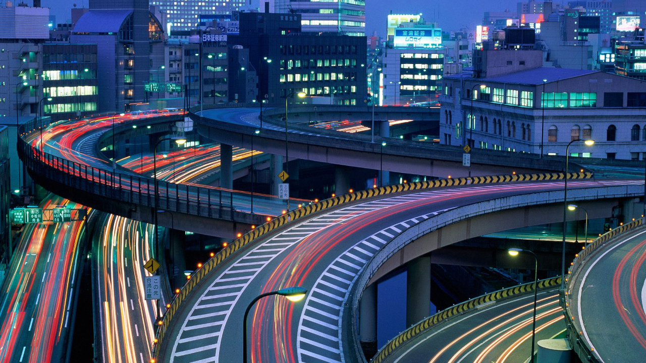 Zeitrafferfotografie Der Stadt Während Der Nachtzeit. Wallpaper in 1280x720 Resolution