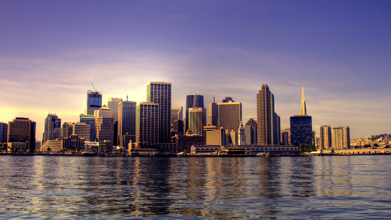 City Skyline Across Body of Water During Daytime. Wallpaper in 1366x768 Resolution