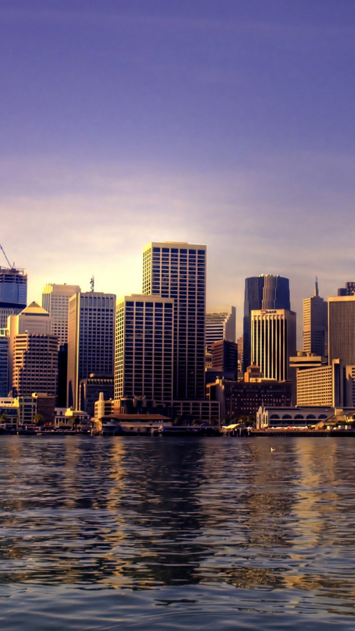City Skyline Across Body of Water During Daytime. Wallpaper in 720x1280 Resolution