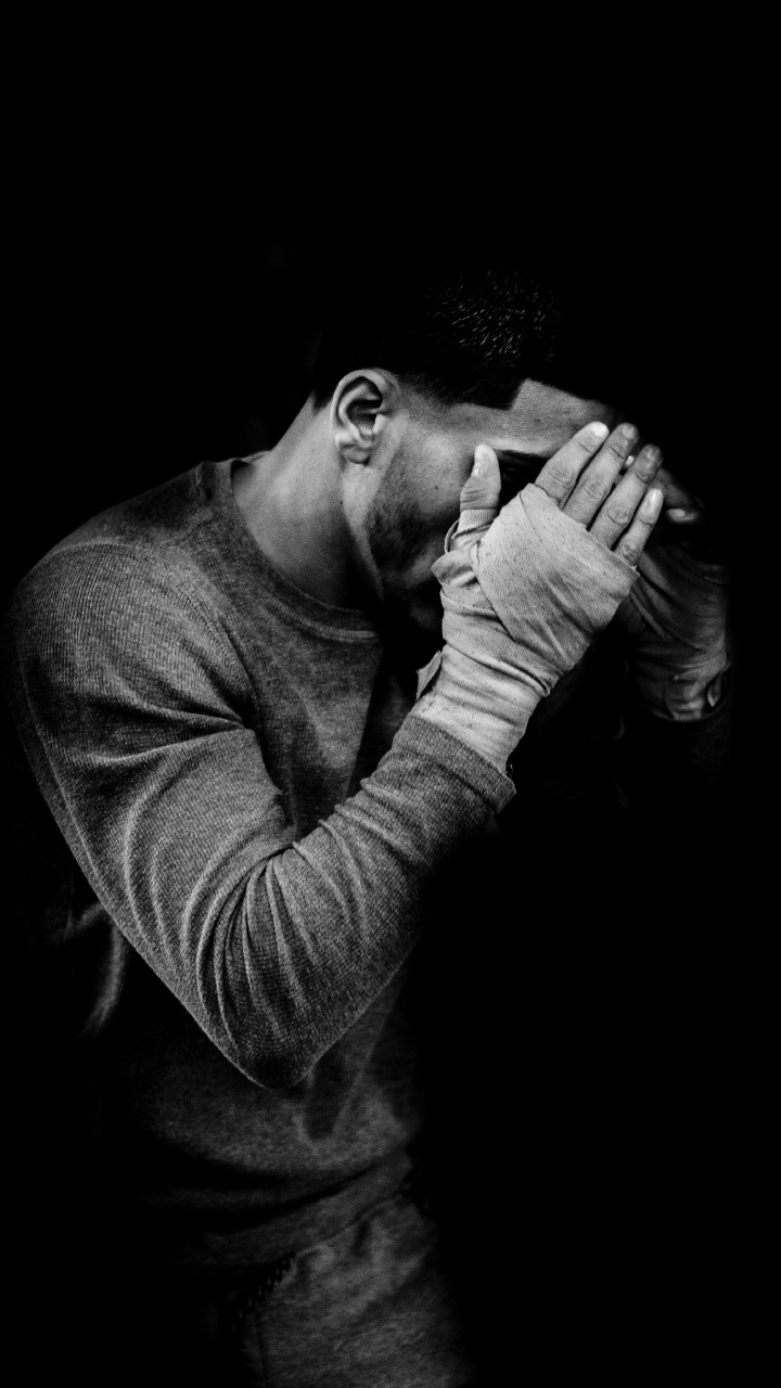 Man in Long Sleeve Shirt Covering His Face. Wallpaper in 720x1280 Resolution