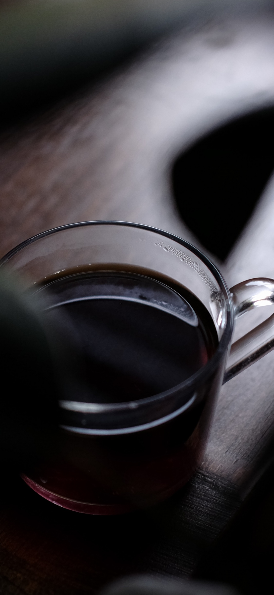 Clear Glass Mug With Brown Liquid Inside. Wallpaper in 1125x2436 Resolution