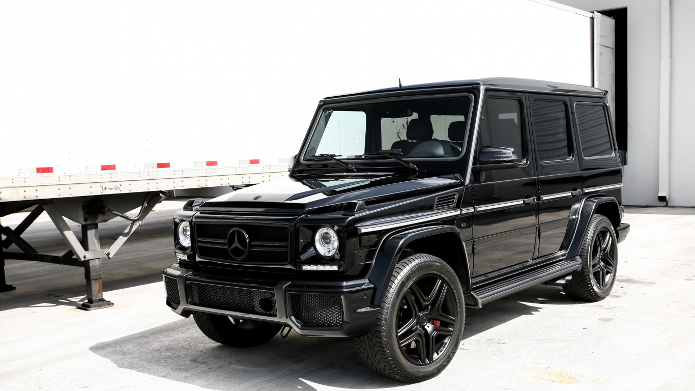 Black Suv on Gray Concrete Road During Daytime. Wallpaper in 1366x768 Resolution