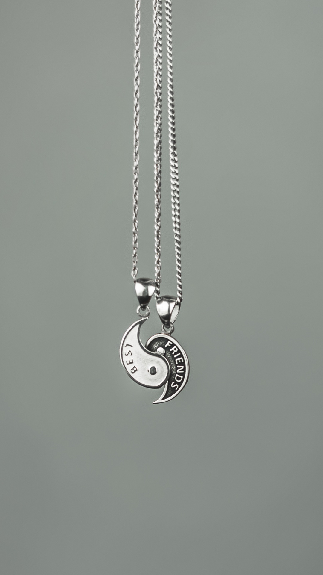 Silver Heart Pendant Necklace on Green Surface. Wallpaper in 1080x1920 Resolution