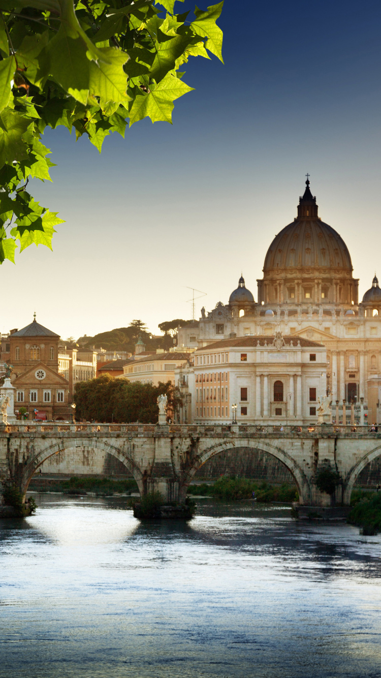 Brown Concrete Building Near Green Trees During Daytime. Wallpaper in 750x1334 Resolution