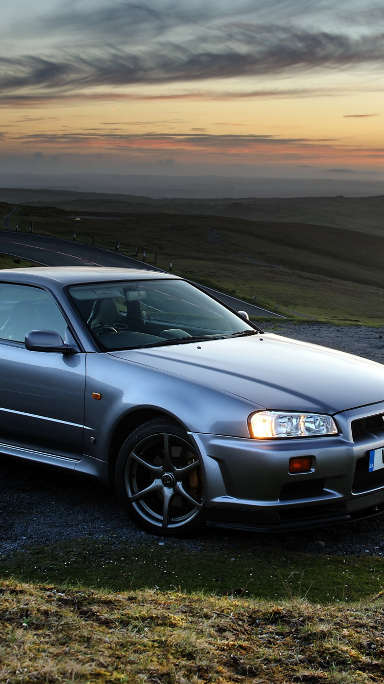 Audi Noir a 4 Sur Champ Marron. Wallpaper in 750x1334 Resolution