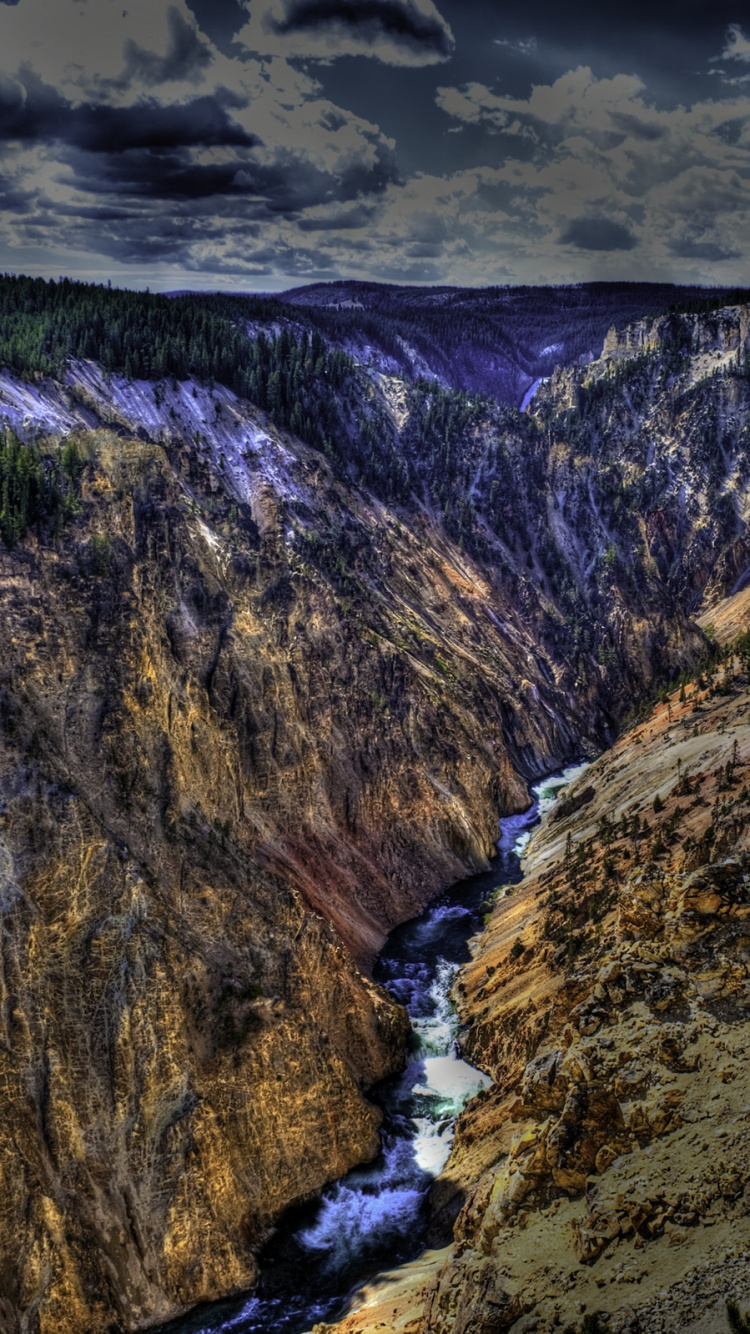 River Between Green and Brown Mountains Under White Clouds During Daytime. Wallpaper in 750x1334 Resolution