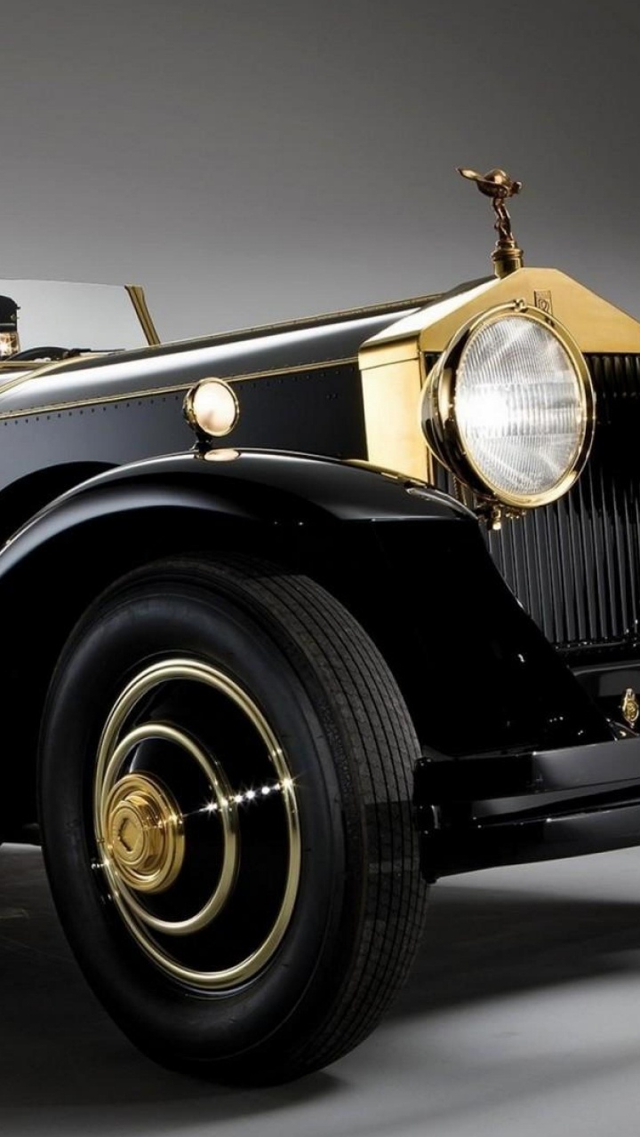 Black Vintage Car on Gray Asphalt Road. Wallpaper in 720x1280 Resolution