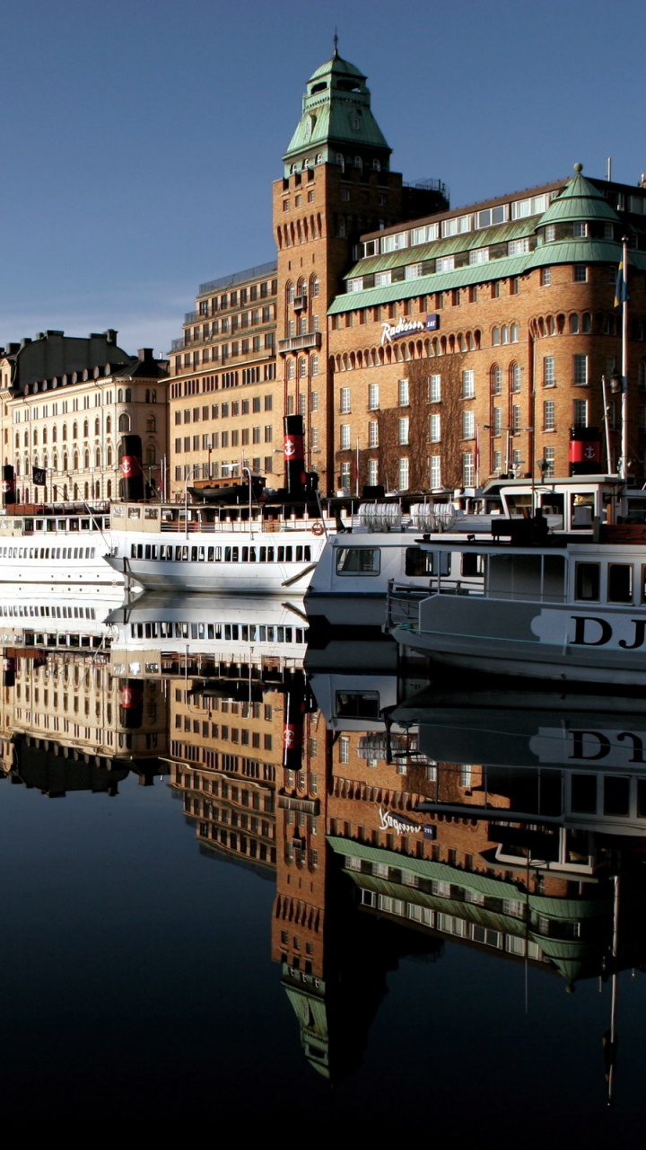 White and Black Boat on Water Near City Buildings During Daytime. Wallpaper in 720x1280 Resolution