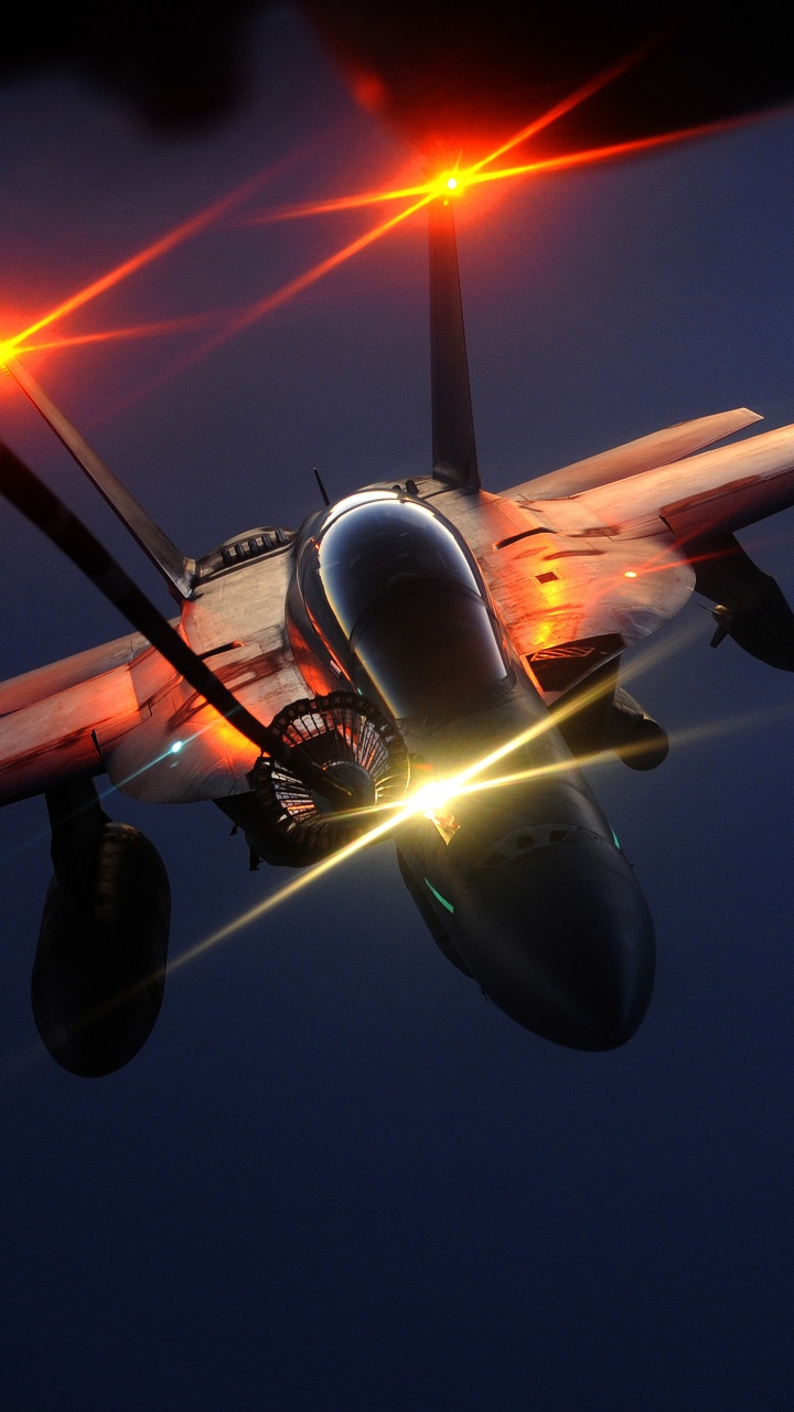 Weißes Und Rotes Düsenflugzeug in Der Luft Tagsüber. Wallpaper in 720x1280 Resolution