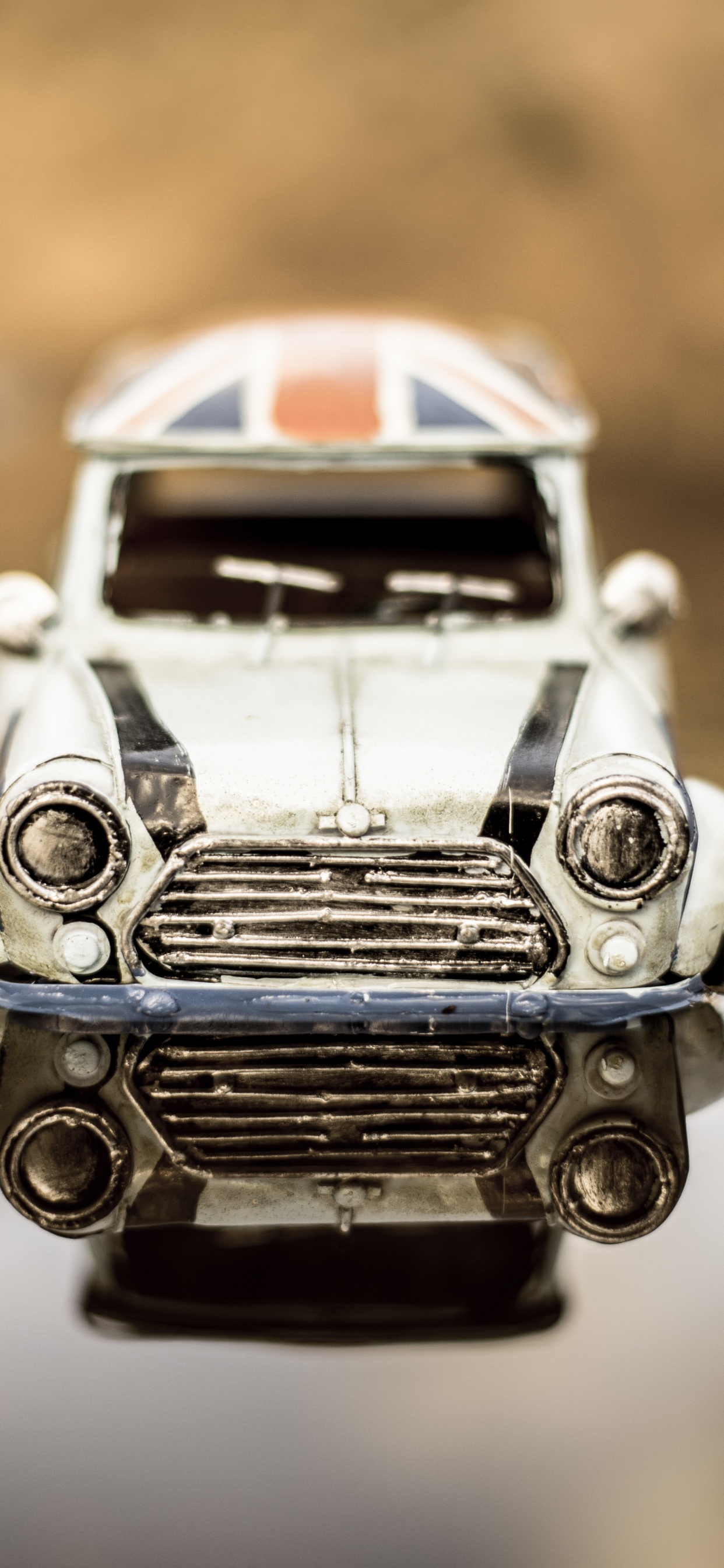 White and Black Car Scale Model. Wallpaper in 1242x2688 Resolution