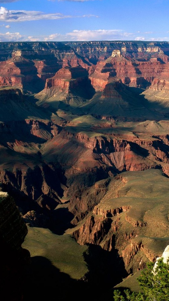 Brown and Green Mountains Under Blue Sky During Daytime. Wallpaper in 720x1280 Resolution