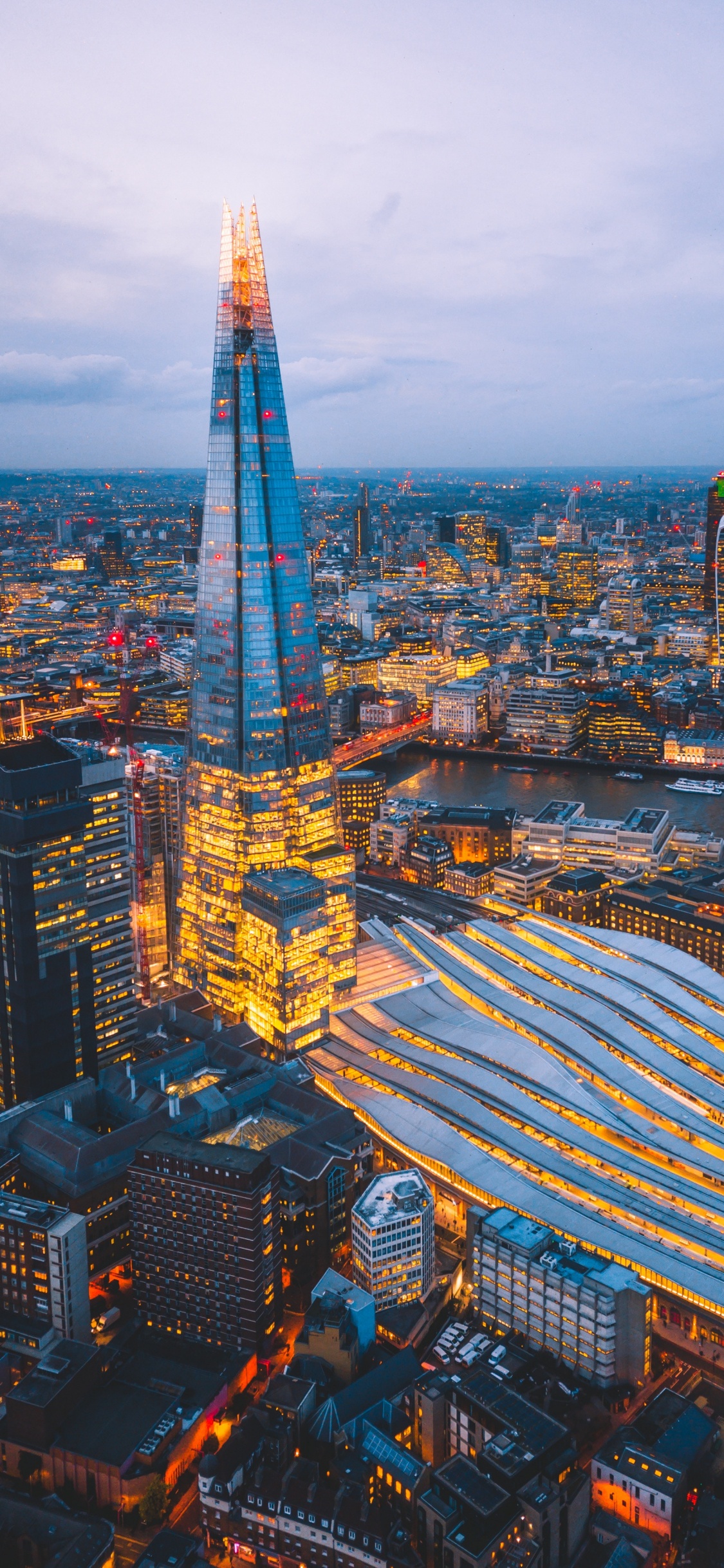 City With High Rise Buildings Under Blue Sky During Daytime. Wallpaper in 1125x2436 Resolution