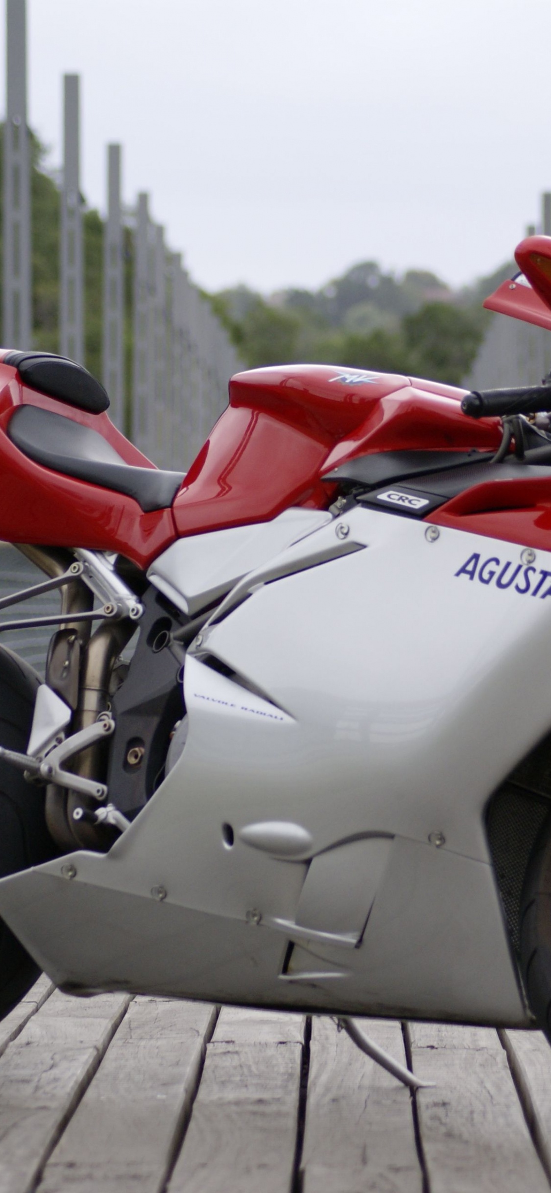 Red and White Sports Bike. Wallpaper in 1125x2436 Resolution