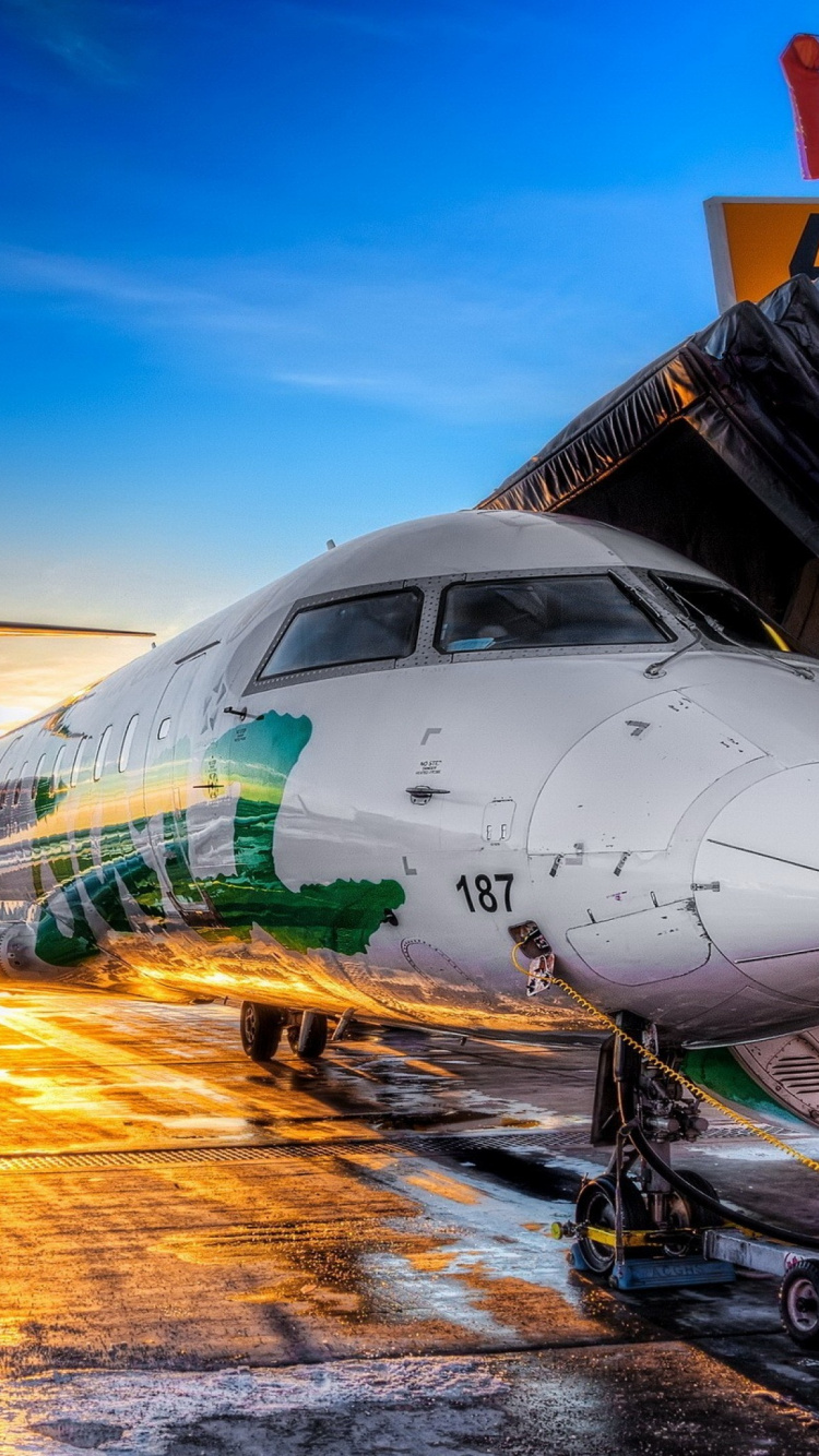 White Airplane on Airport During Daytime. Wallpaper in 750x1334 Resolution