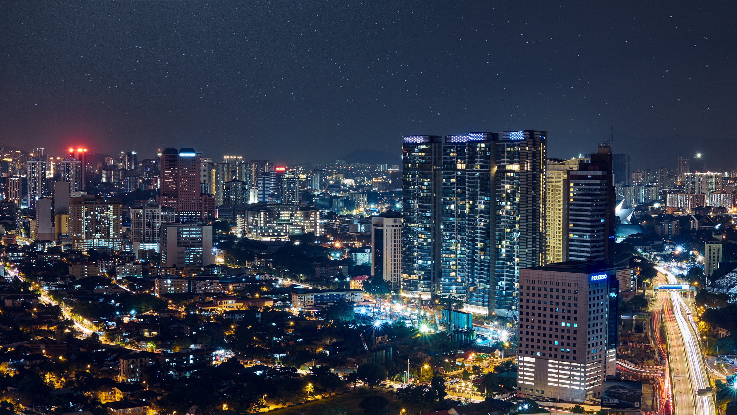 City With High Rise Buildings During Night Time. Wallpaper in 2560x1440 Resolution