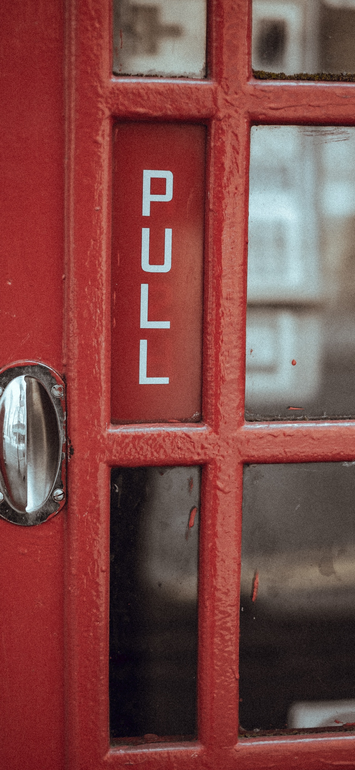 Red Telephone Booth With Silver Door Knob. Wallpaper in 1242x2688 Resolution