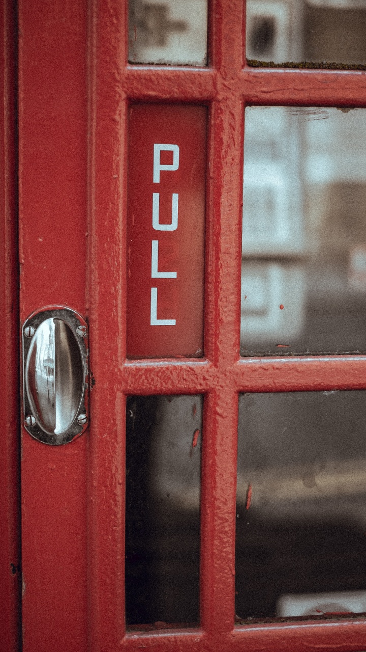 Red Telephone Booth With Silver Door Knob. Wallpaper in 720x1280 Resolution