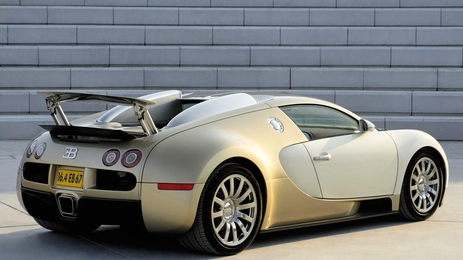 Black Porsche 911 Parked in Front of Gray Brick Wall. Wallpaper in 1920x1080 Resolution