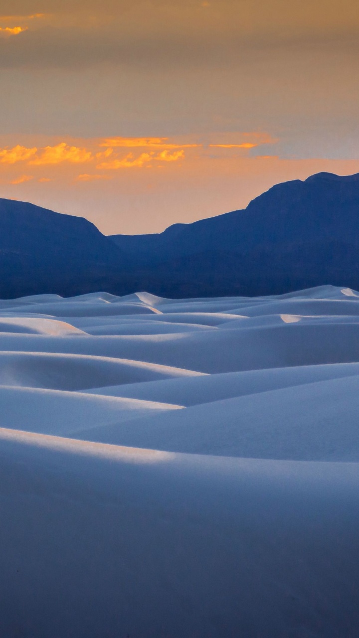 Snow Covered Field Near Mountains During Daytime. Wallpaper in 720x1280 Resolution