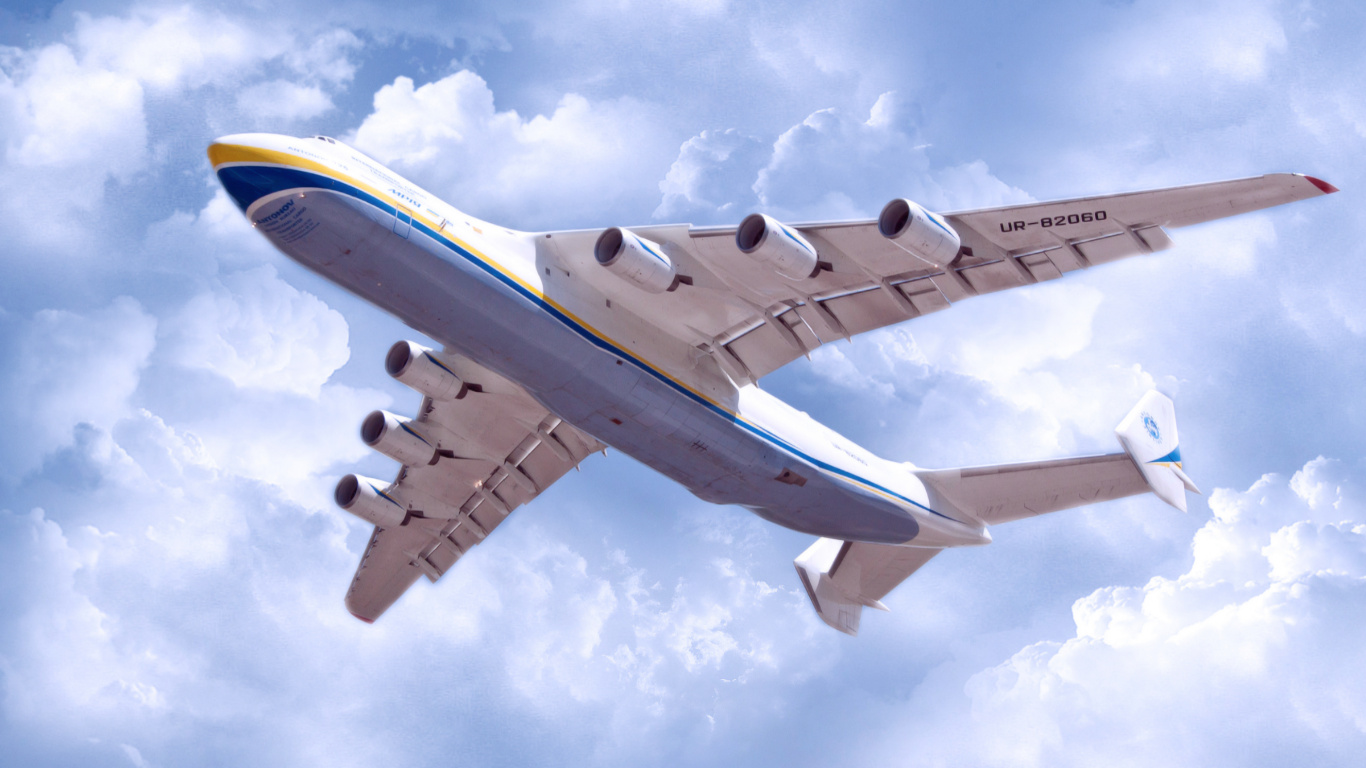 White and Blue Airplane Under White Clouds and Blue Sky During Daytime. Wallpaper in 1366x768 Resolution