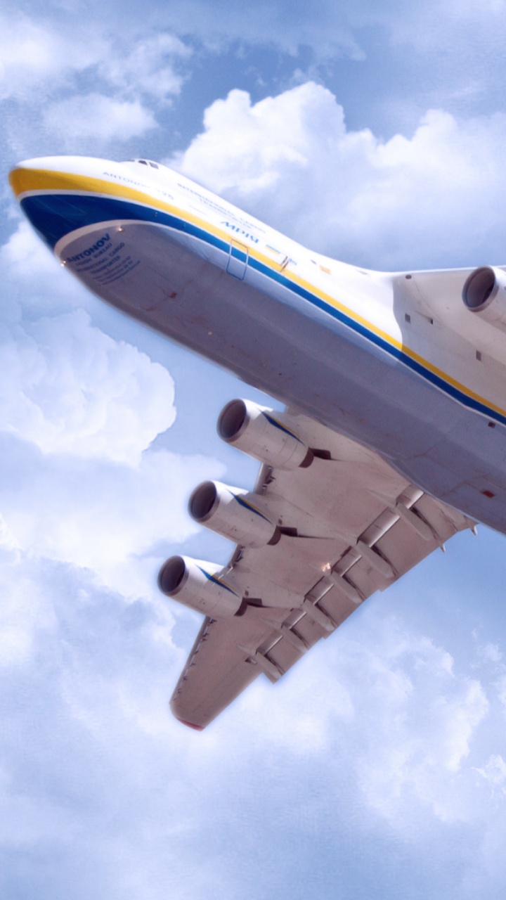 White and Blue Airplane Under White Clouds and Blue Sky During Daytime. Wallpaper in 720x1280 Resolution