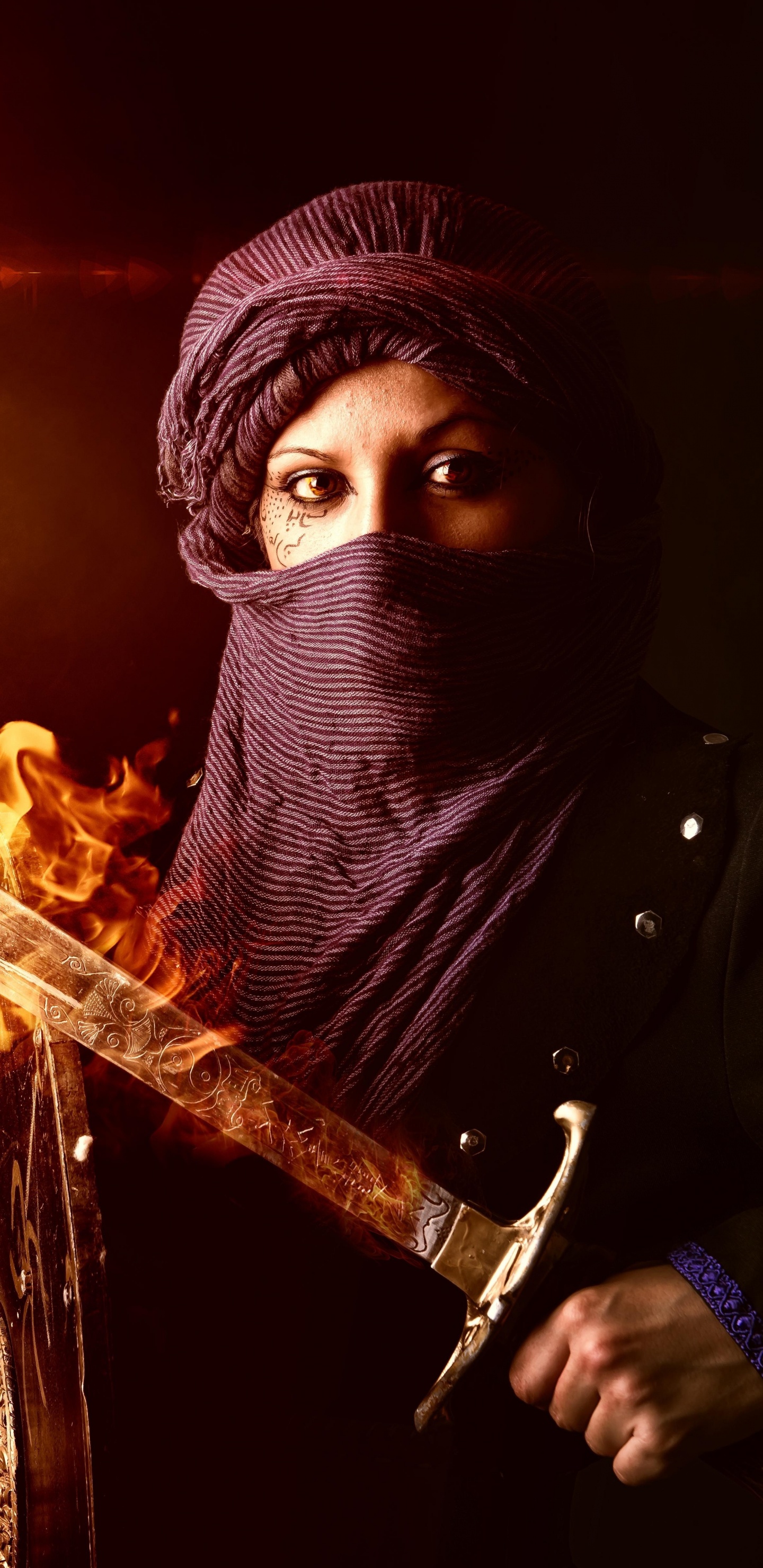 Person in Black Hoodie Holding Fire. Wallpaper in 1440x2960 Resolution