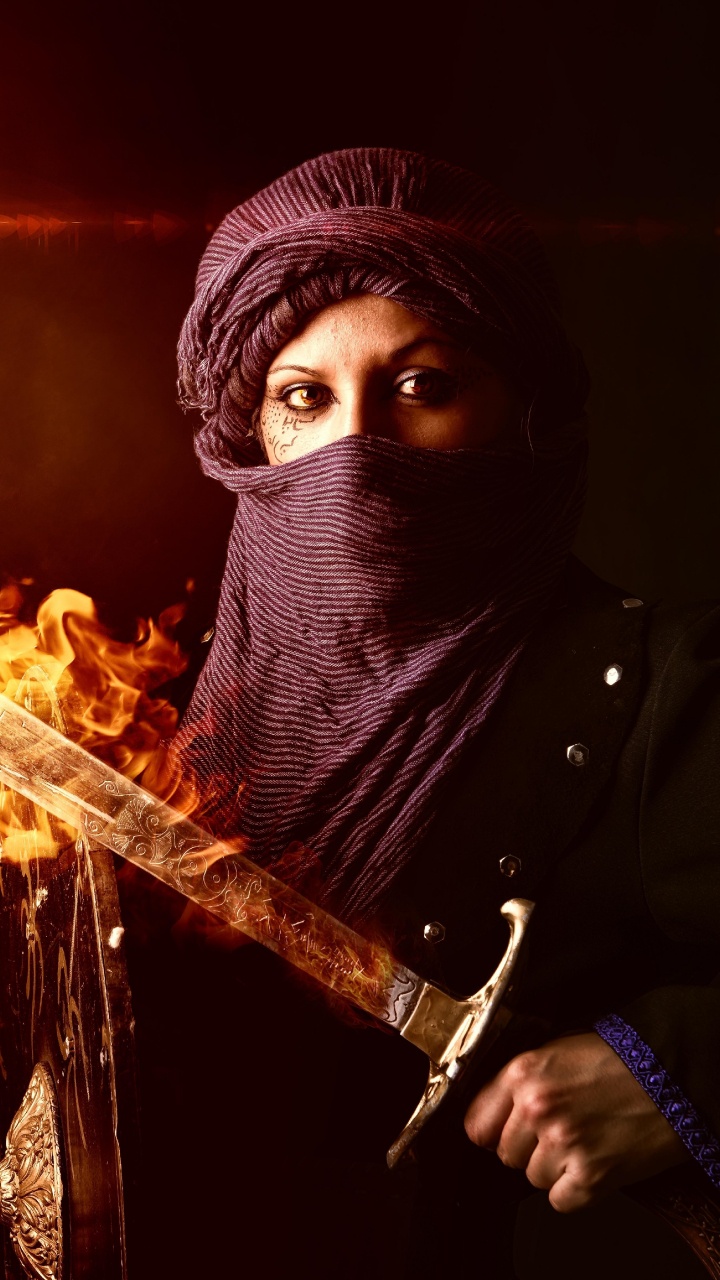 Person in Black Hoodie Holding Fire. Wallpaper in 720x1280 Resolution