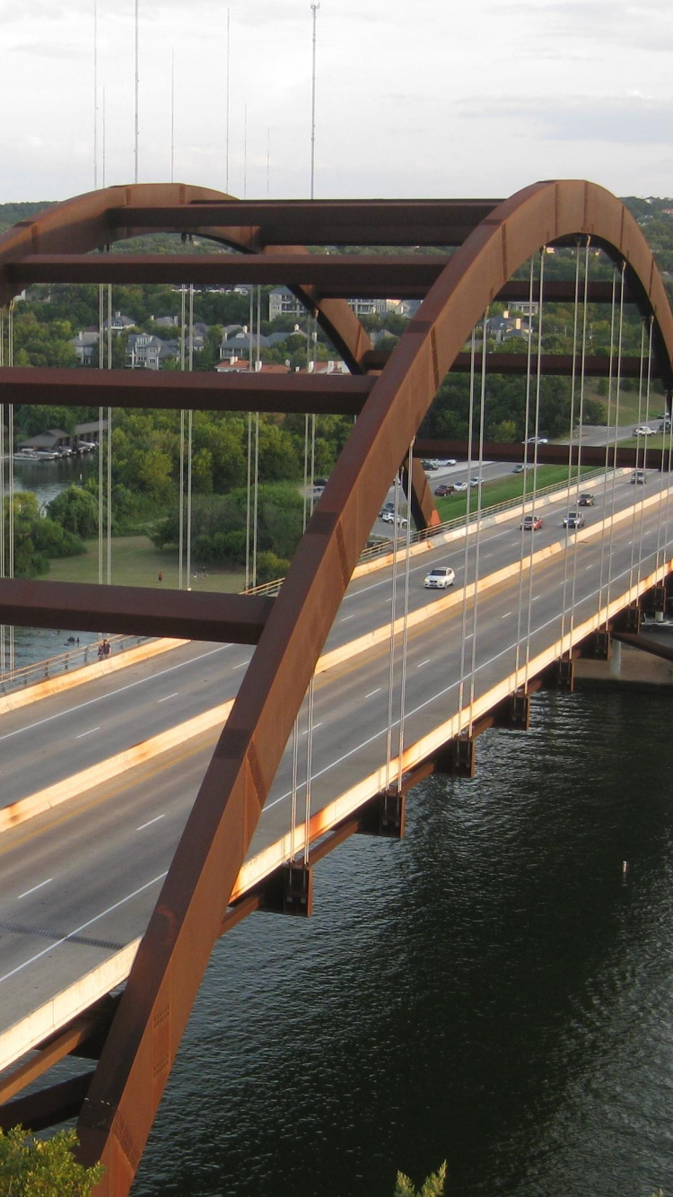 Brown Wooden Bridge Over River During Daytime. Wallpaper in 750x1334 Resolution
