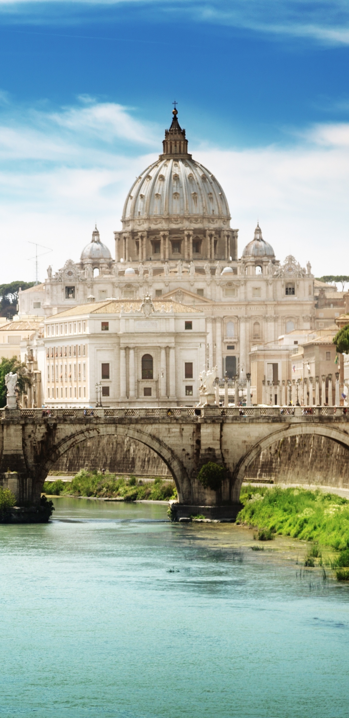 White Concrete Building Near Body of Water During Daytime. Wallpaper in 1440x2960 Resolution
