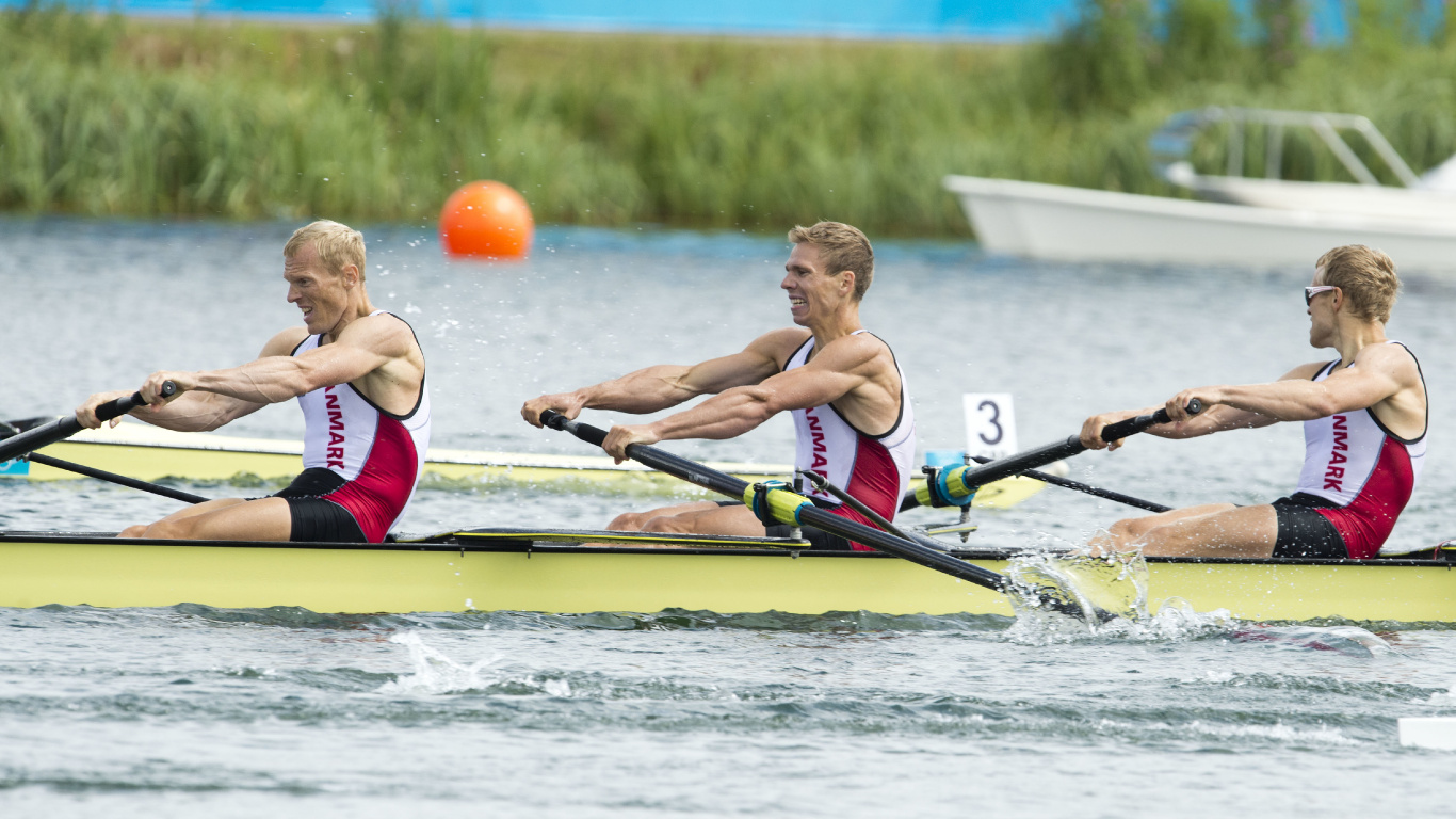 2 Boys in Red and Black Shorts Riding on Blue Kayak on River During Daytime. Wallpaper in 1366x768 Resolution