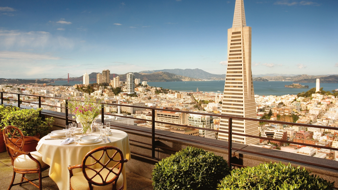 White and Brown Wooden Table and Chairs Near Green Trees and City Buildings During Daytime. Wallpaper in 1280x720 Resolution