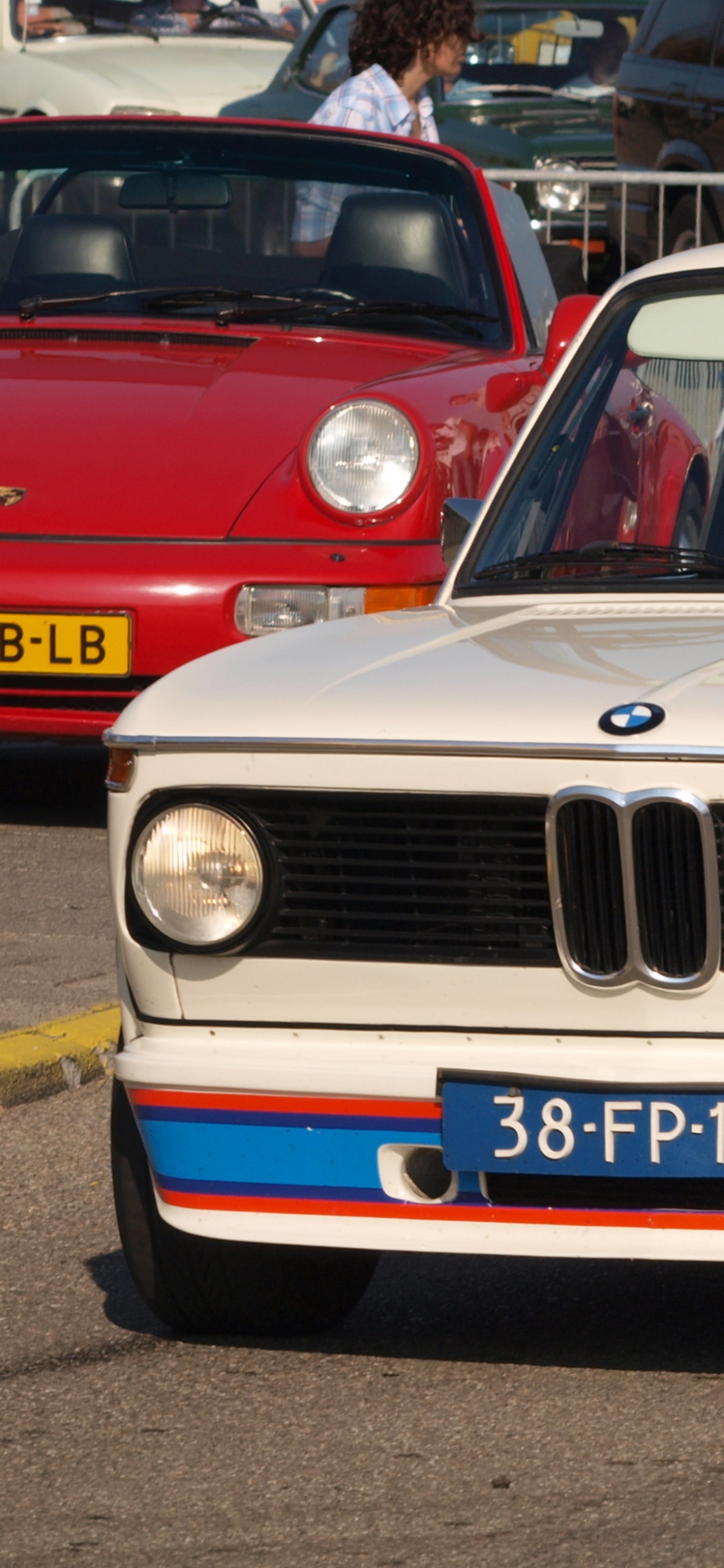 White and Blue Jeep Grand Cherokee. Wallpaper in 1125x2436 Resolution