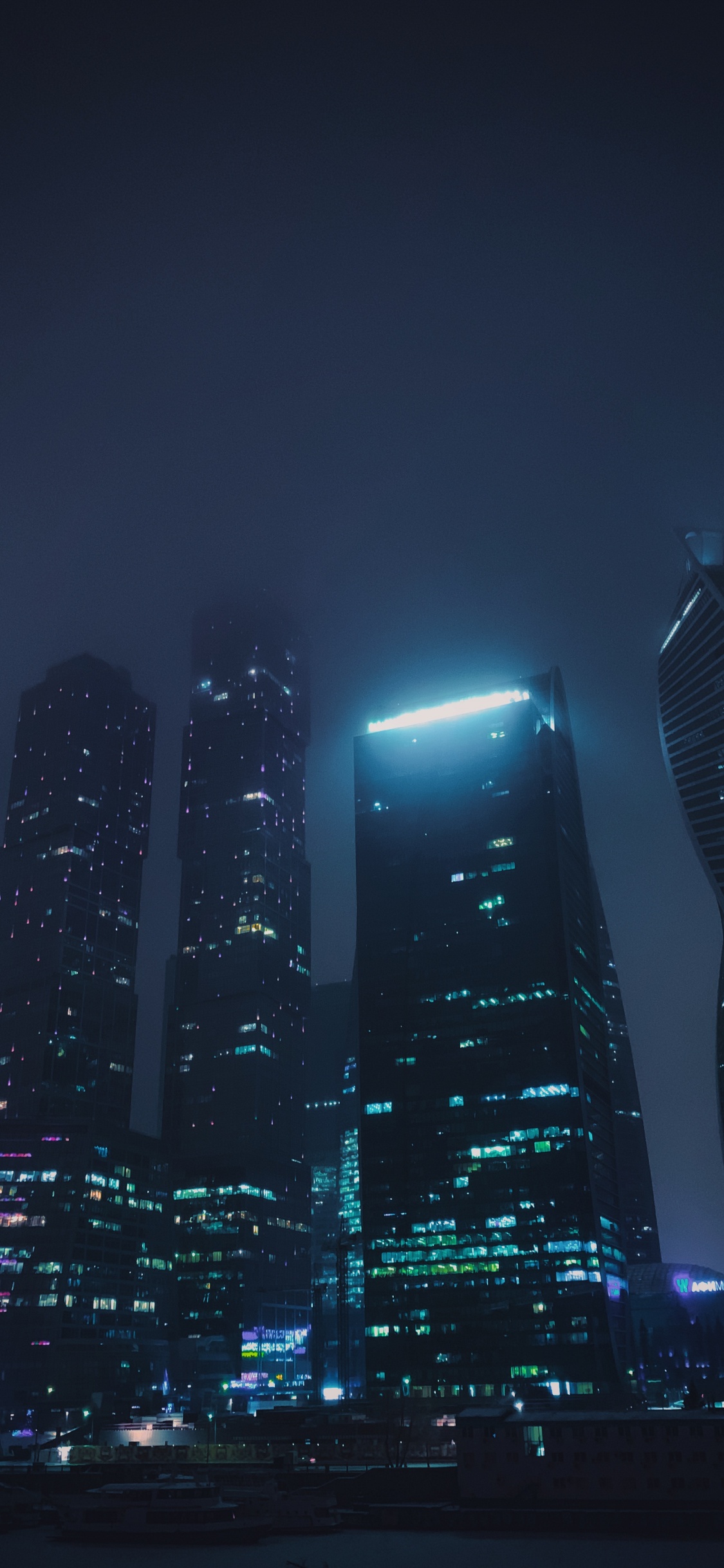 High Rise Buildings During Night Time. Wallpaper in 1125x2436 Resolution