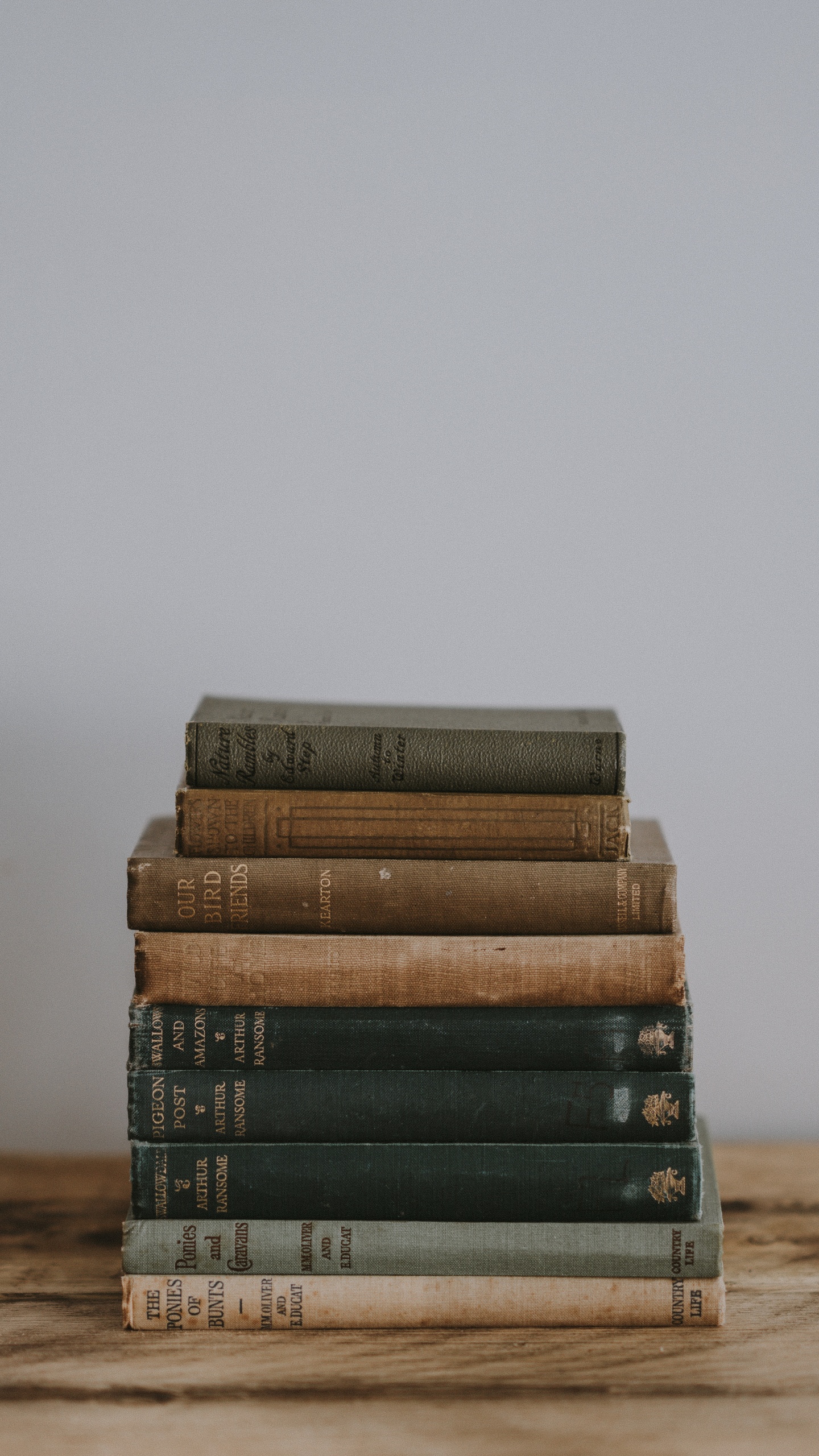 Stack of Books on Brown Wooden Table. Wallpaper in 1440x2560 Resolution