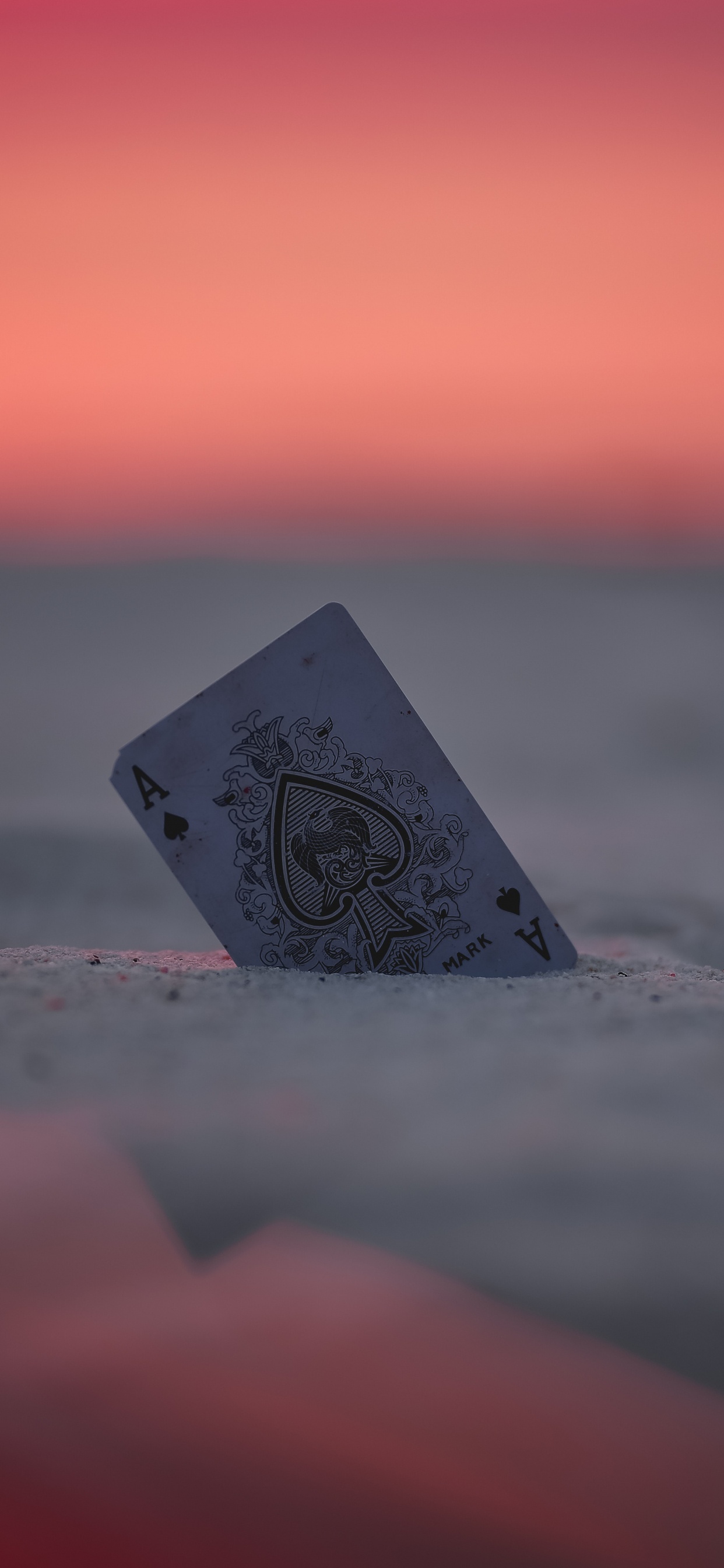Gray and Black Heart on Gray Sand During Sunset. Wallpaper in 1242x2688 Resolution
