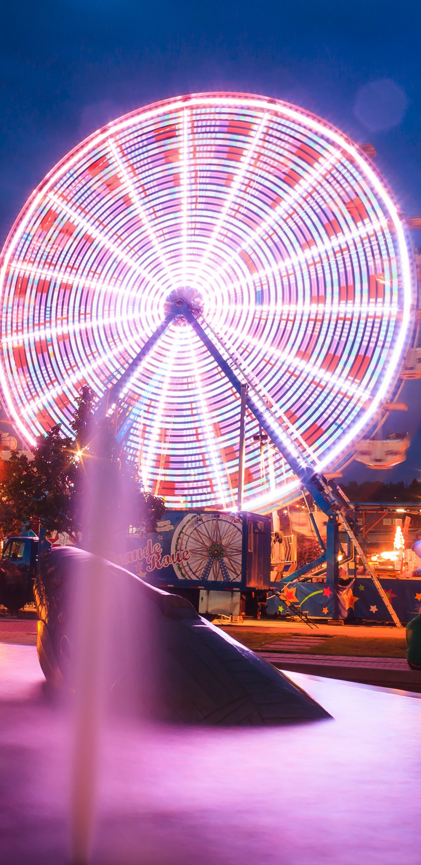White Round Building With Lights During Night Time. Wallpaper in 1440x2960 Resolution