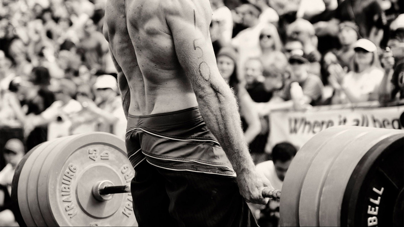 Oben Ohne Mann in Schwarzen Shorts Mit Langhantel Bar. Wallpaper in 1366x768 Resolution