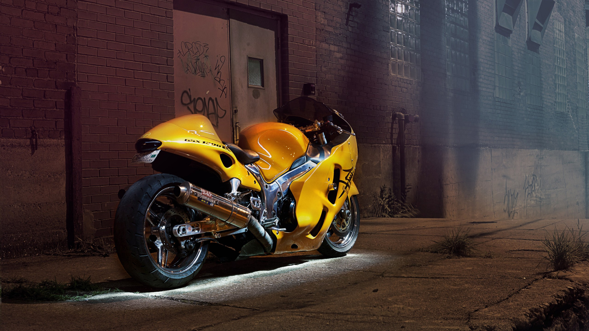 Yellow and Black Sports Bike Parked Beside Brown Brick Wall. Wallpaper in 1920x1080 Resolution