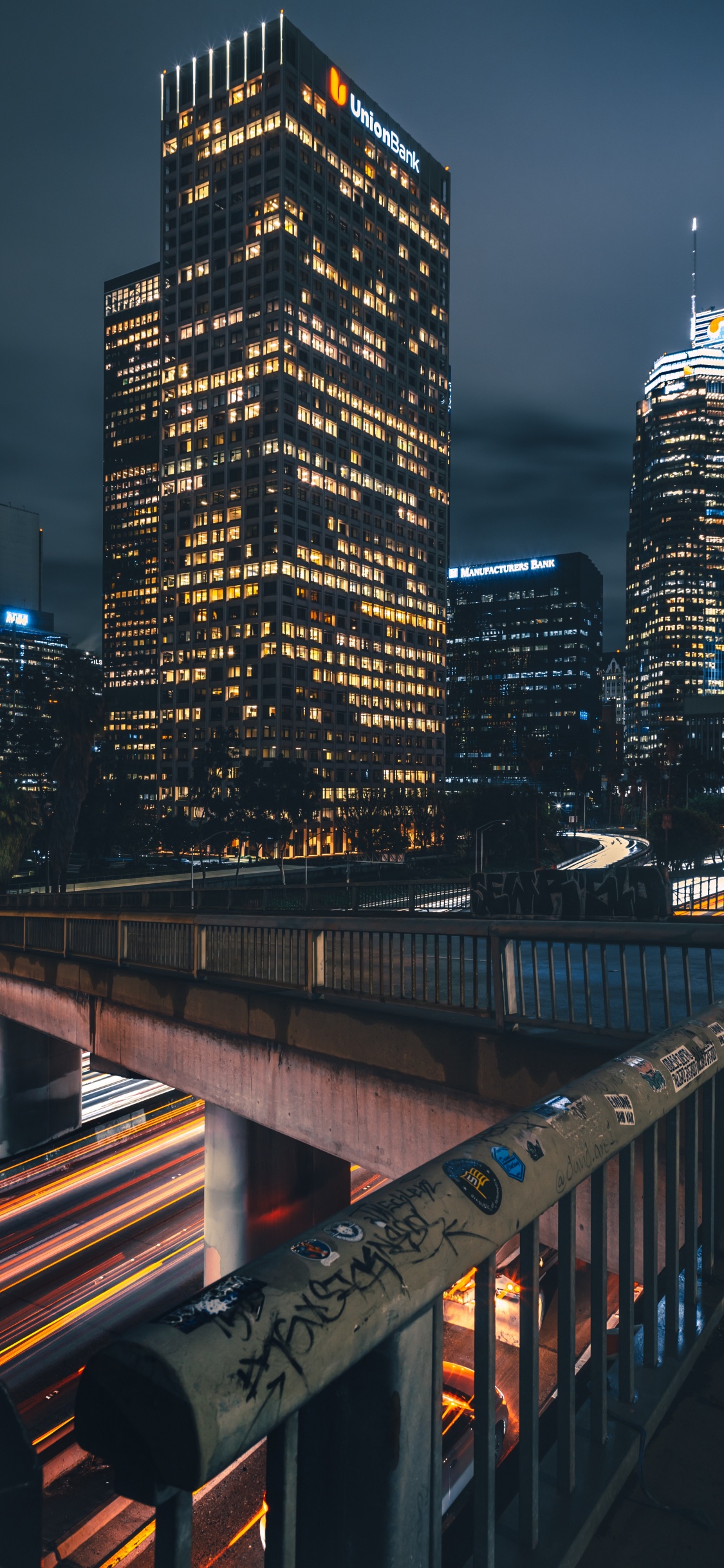 City Skyline During Night Time. Wallpaper in 1125x2436 Resolution