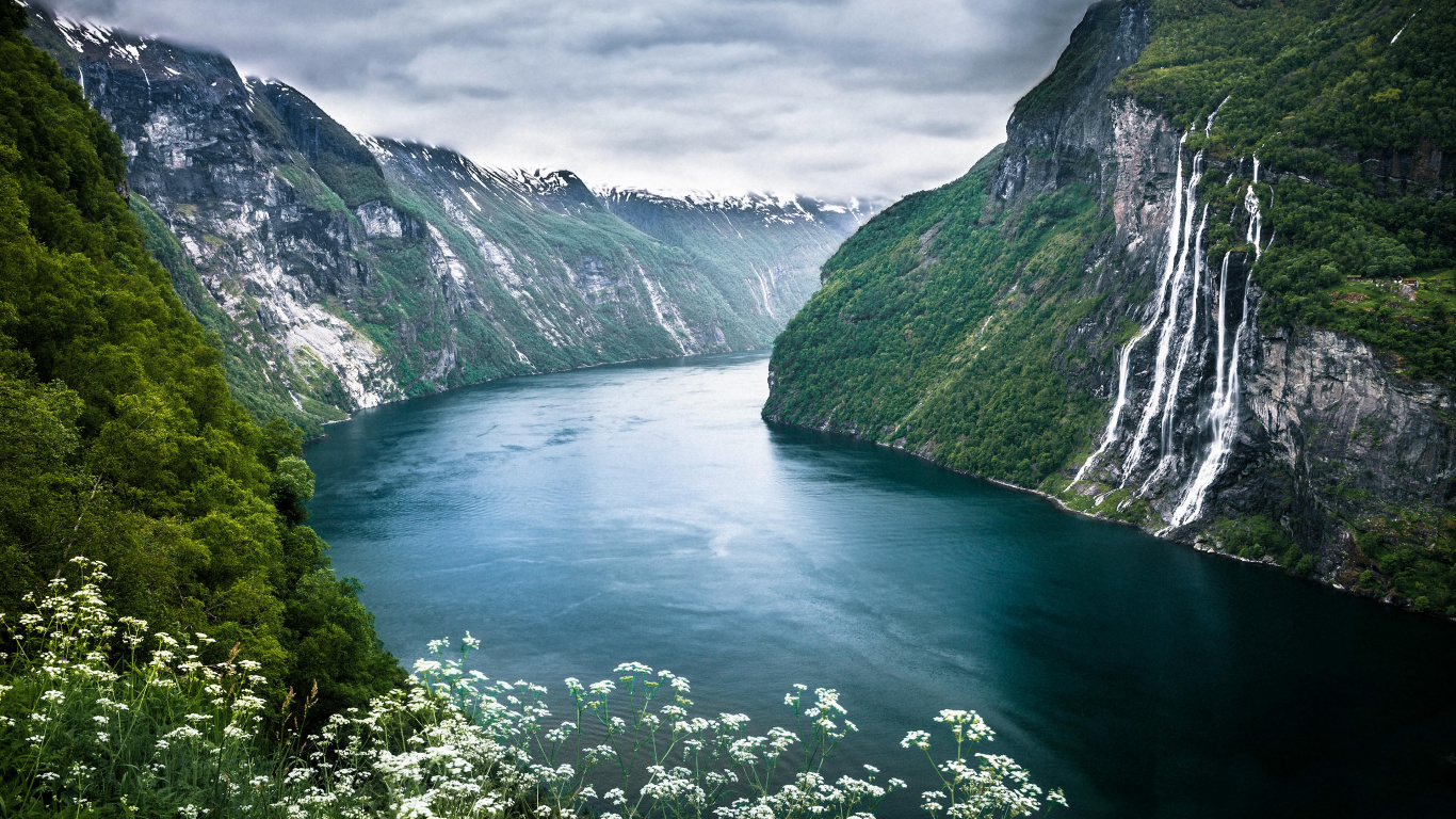 Green Lake Between Green Mountains Under White Clouds During Daytime. Wallpaper in 1366x768 Resolution