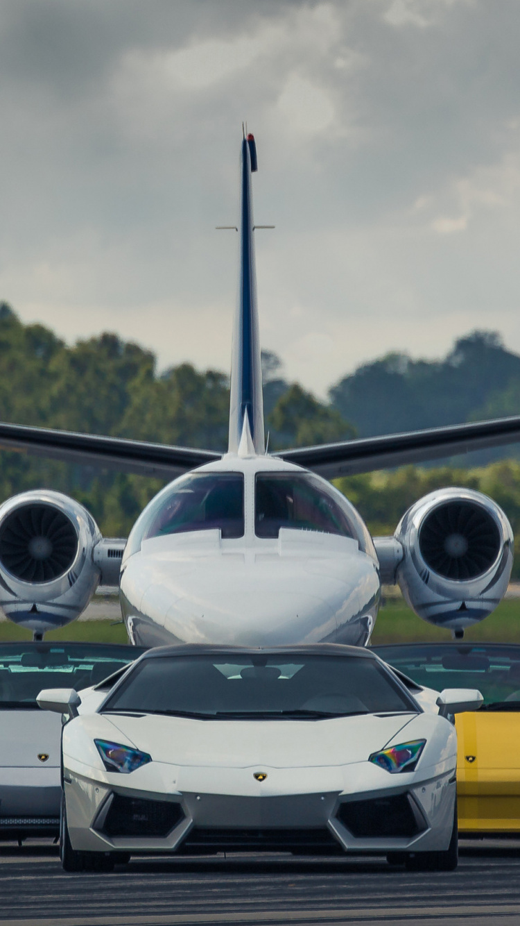 Yellow and White Chevrolet Camaro on a Sunny Day. Wallpaper in 750x1334 Resolution