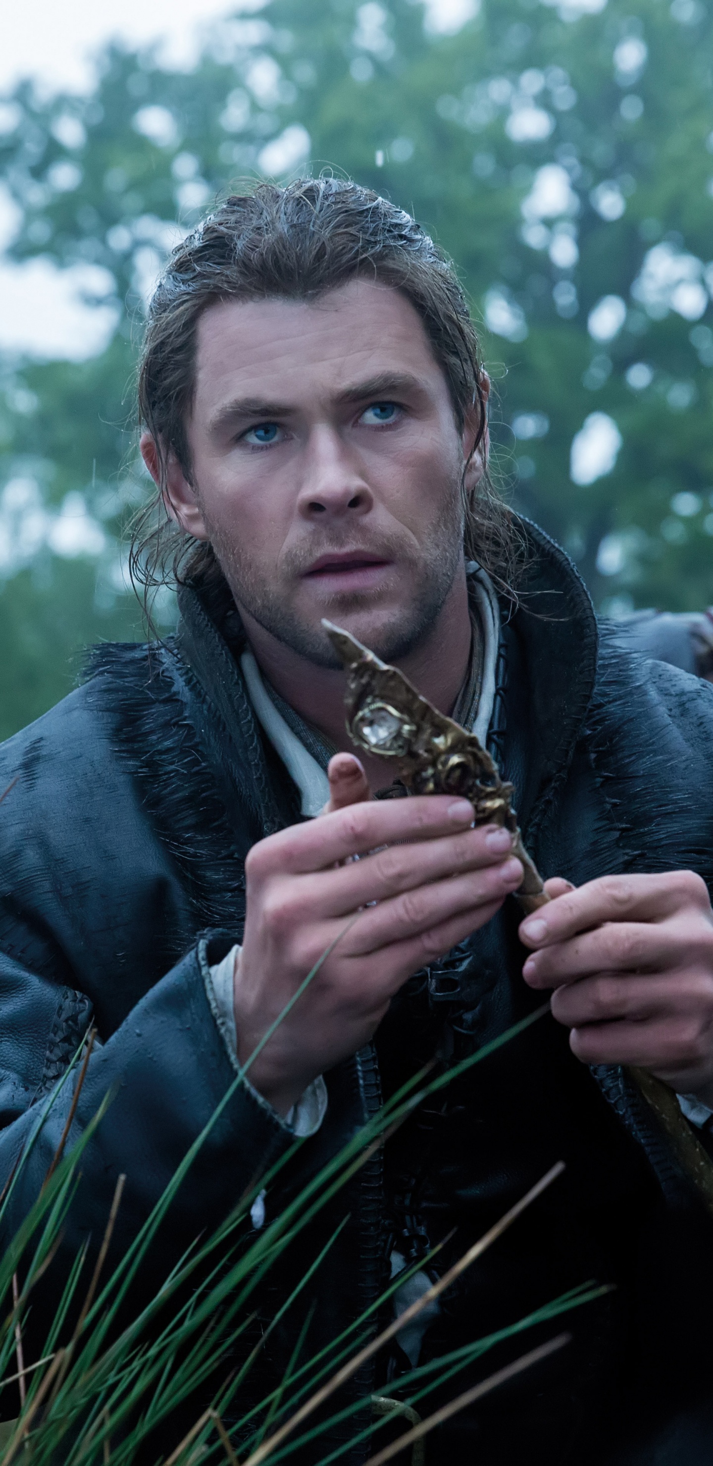 Man in Blue Denim Jacket Holding Brown and Black Snake. Wallpaper in 1440x2960 Resolution