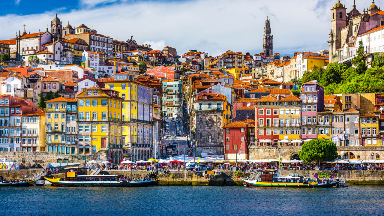 City Buildings Near Body of Water During Daytime. Wallpaper in 1280x720 Resolution