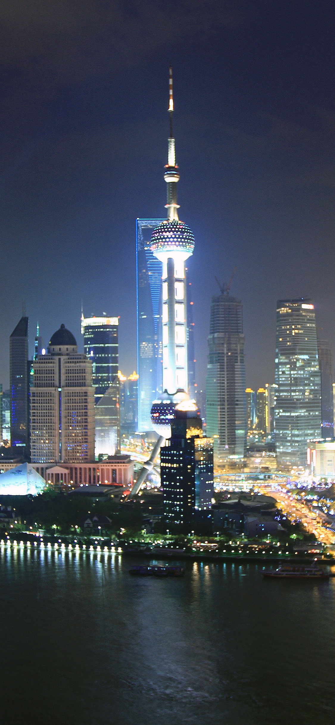 City Skyline During Night Time. Wallpaper in 1125x2436 Resolution