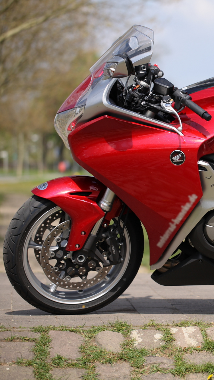 Red and Black Sports Bike on Road During Daytime. Wallpaper in 750x1334 Resolution