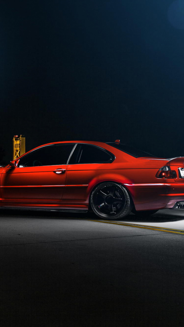 Coupé Orange Sur Route Pendant la Nuit. Wallpaper in 750x1334 Resolution