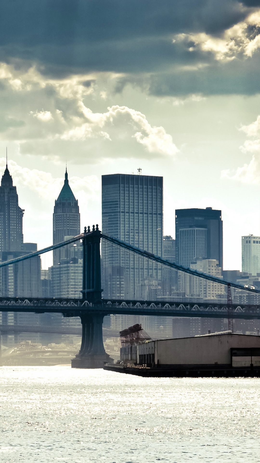 Bridge Over Body of Water Near City Buildings During Daytime. Wallpaper in 1080x1920 Resolution