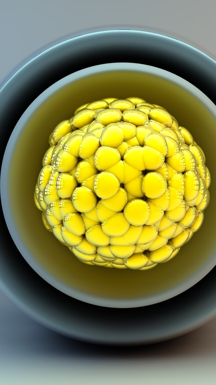 Yellow Beads in White and Blue Ceramic Bowl. Wallpaper in 720x1280 Resolution